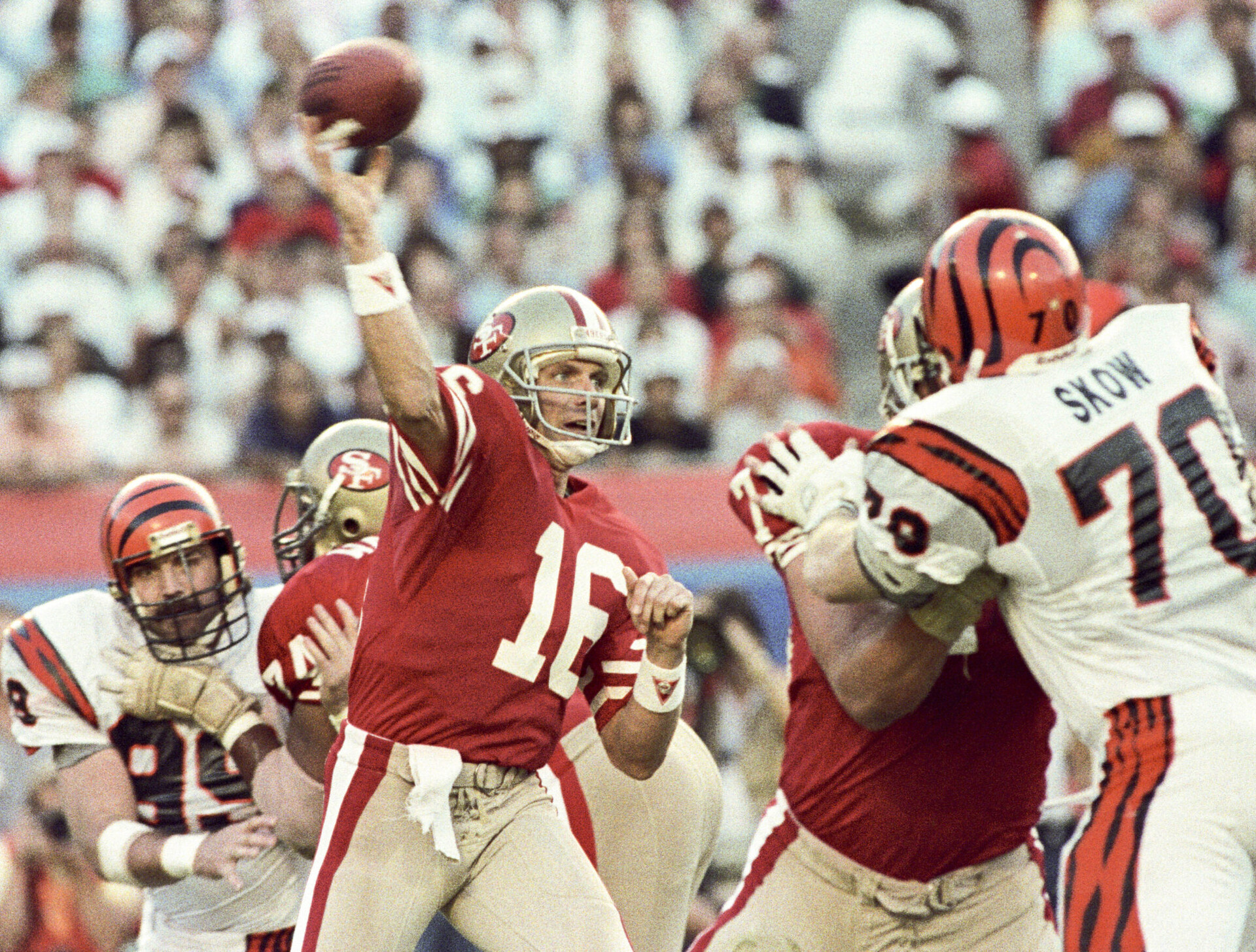 San Francisco 49ers quarterback Joe Montana (left) attempts to pass the ball against the Cincinnati Bengals during Super Bowl XXIII