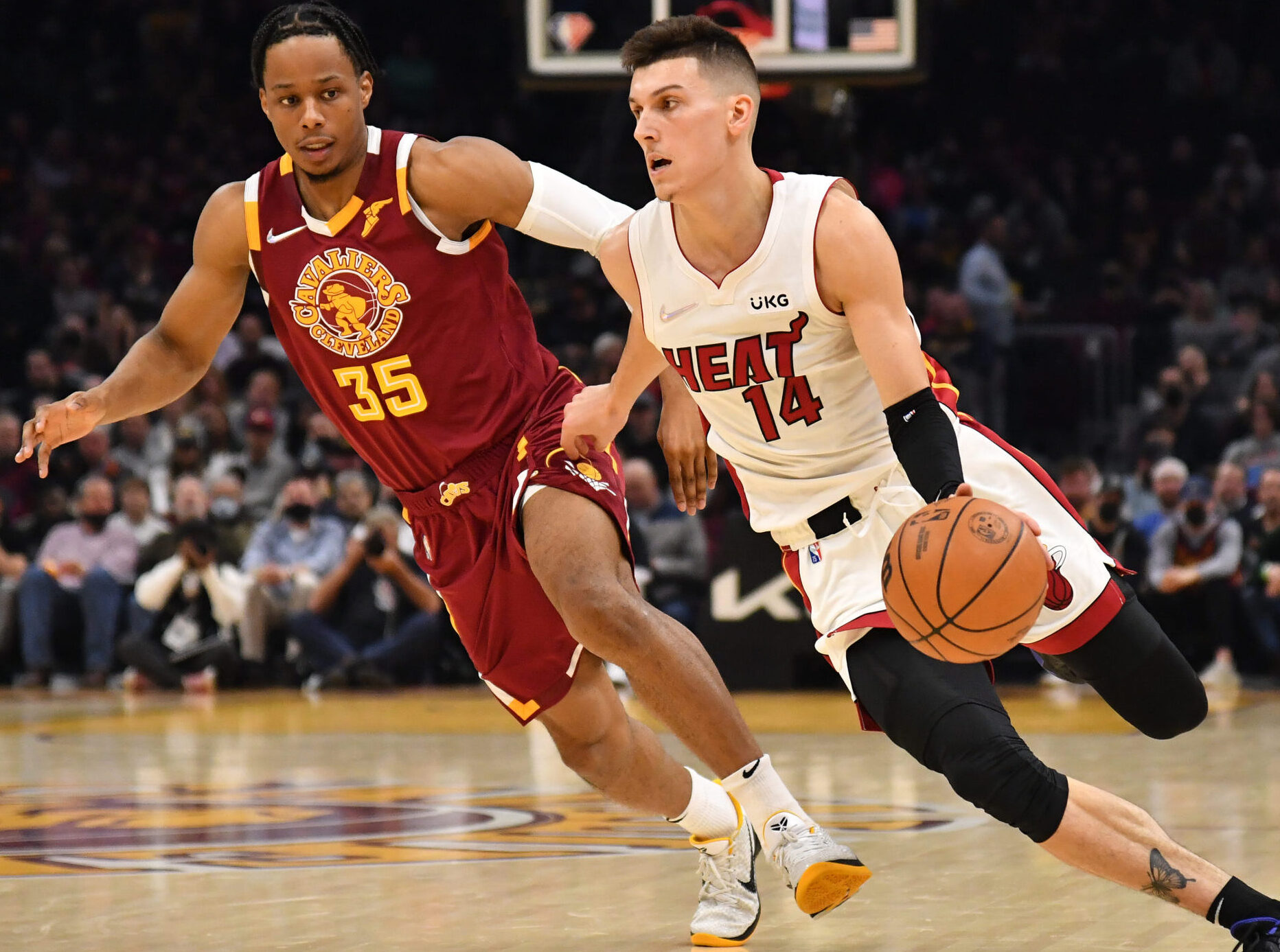 Tyler Herro #14 of the Miami Heat drives to the basket around Isaac Okoro #35 of the Cleveland Cavaliers during the second quarter at Rocket Mortgage Fieldhouse on December 13, 2021 in Cleveland, Ohio.
