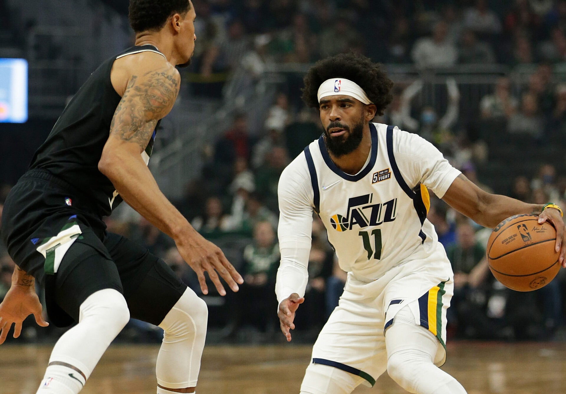 Mike Conley #11 of the Utah Jazz in action against the Milwaukee Bucks at Fiserv Forum on October 31, 2021 in Milwaukee, Wisconsin. Jazz defeated the Bucks 107-95