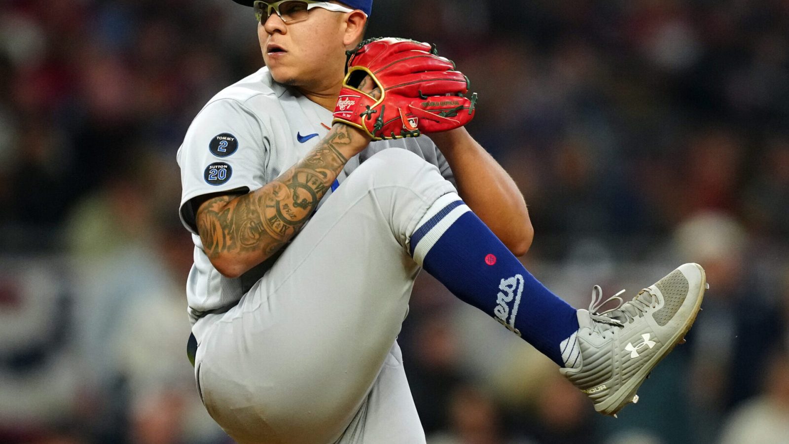 Julio Urias #7 of the Los Angeles Dodgers pitches during Game 2 of the NLCS between the Los Angeles Dodgers and the Atlanta Braves at Truist Park on Sunday, October 17, 2021 in Atlanta, Georgia.