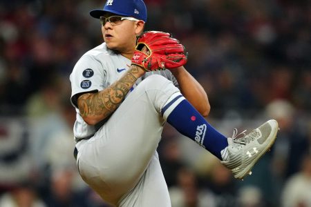 Julio Urias #7 of the Los Angeles Dodgers pitches during Game 2 of the NLCS between the Los Angeles Dodgers and the Atlanta Braves at Truist Park on Sunday, October 17, 2021 in Atlanta, Georgia.