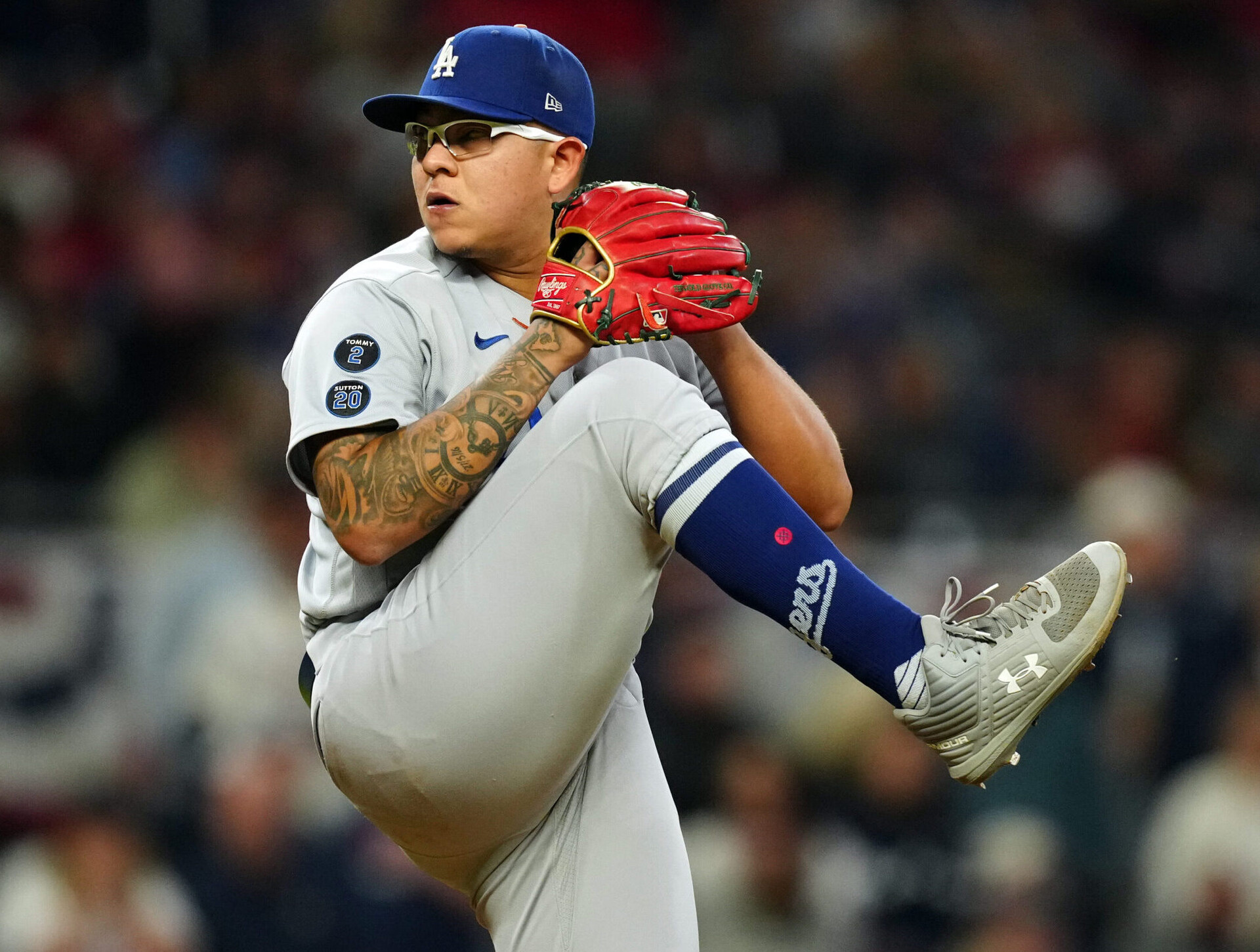 Julio Urias #7 of the Los Angeles Dodgers pitches during Game 2 of the NLCS between the Los Angeles Dodgers and the Atlanta Braves at Truist Park on Sunday, October 17, 2021 in Atlanta, Georgia.