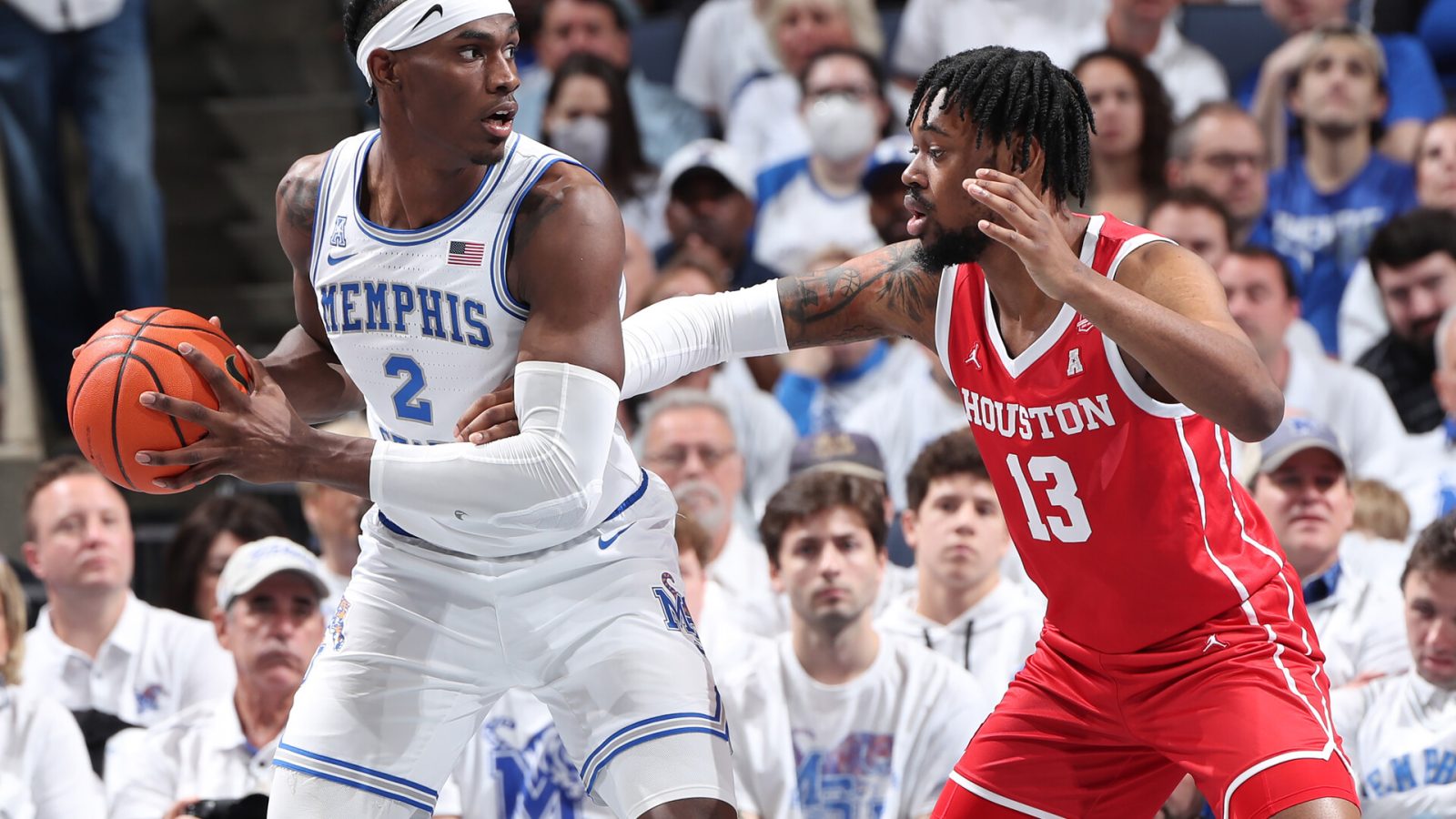 Jalen Duren #2 of the Memphis Tigers dribbles the ball against JWan Roberts #13 of the Houston Cougars during a game on March 6, 2022 at FedExForum in Memphis, Tennessee. Memphis defeated Houston 75-61.