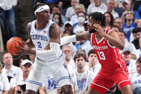 Jalen Duren #2 of the Memphis Tigers dribbles the ball against JWan Roberts #13 of the Houston Cougars during a game on March 6, 2022 at FedExForum in Memphis, Tennessee. Memphis defeated Houston 75-61.