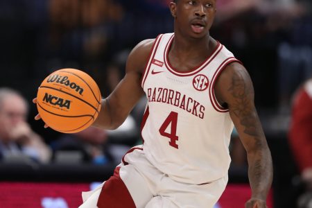 Arkansas Razorbacks guard Davonte Davis (4) leads a fast break for the Razorbacks during the SEC Tournament between the Texas A&M Aggies and the Arkansas Razorbacks on Thursday, March 11, 2022