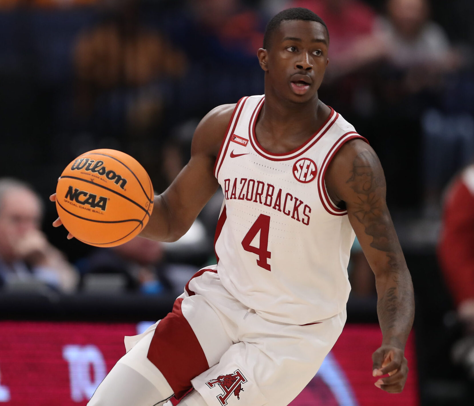 Arkansas Razorbacks guard Davonte Davis (4) leads a fast break for the Razorbacks during the SEC Tournament between the Texas A&M Aggies and the Arkansas Razorbacks on Thursday, March 11, 2022