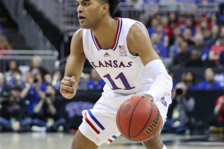 Kansas Jayhawks guard Remy Martin (11) with the ball in the first half of the Big 12 Tournament championship game between the Texas Tech Red Raiders and Kansas Jayhawks on Mar 12, 2022 at T-Mobile Arena in Kansas City, MO.