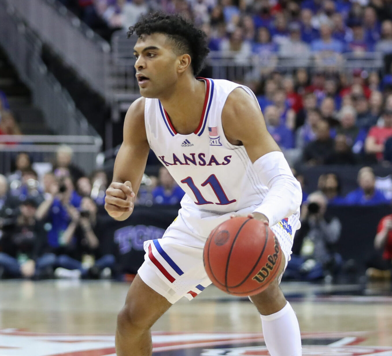 Kansas Jayhawks guard Remy Martin (11) with the ball in the first half of the Big 12 Tournament championship game between the Texas Tech Red Raiders and Kansas Jayhawks on Mar 12, 2022 at T-Mobile Arena in Kansas City, MO.