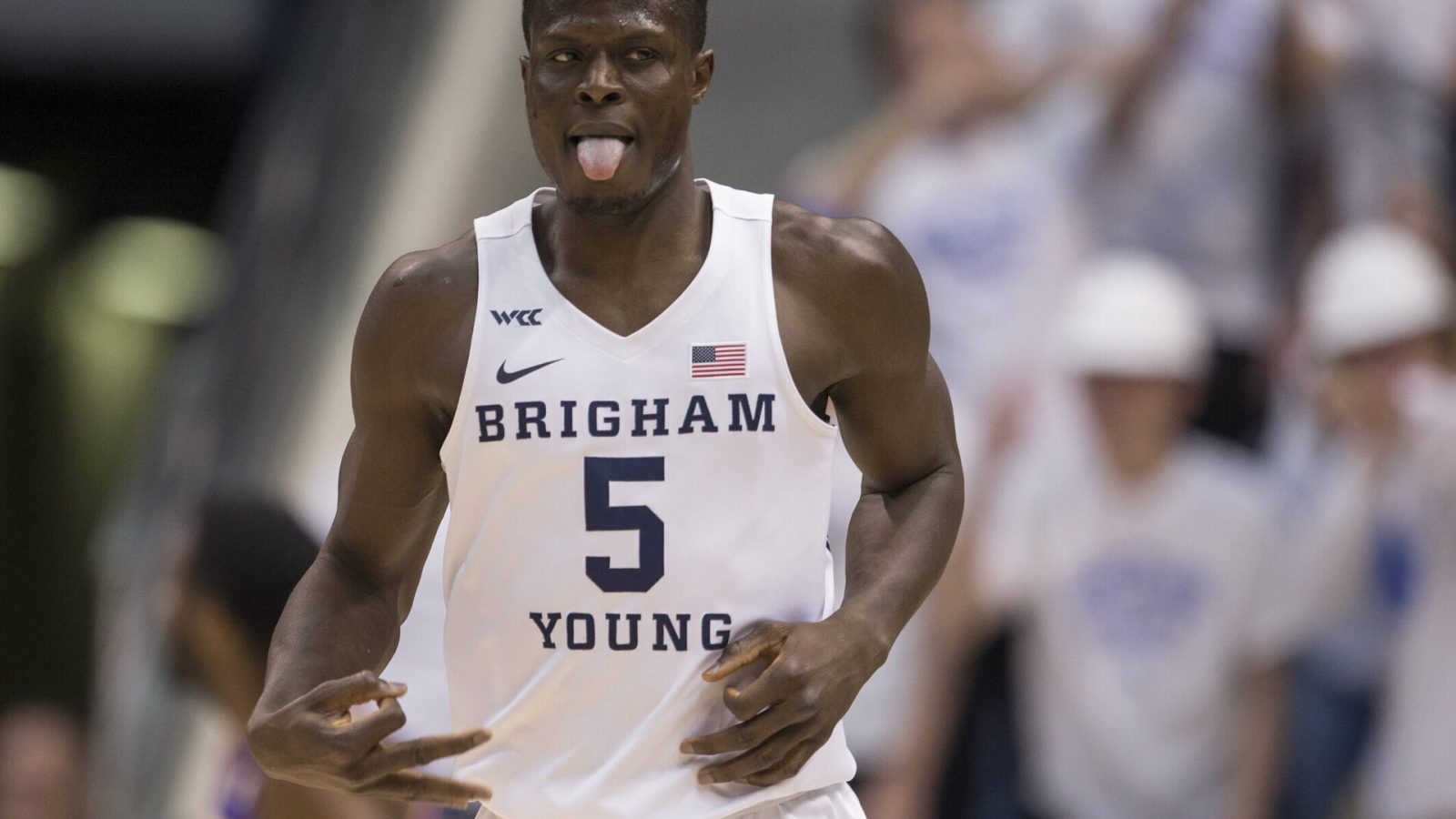 Gideon George #5 of the Brigham Young Cougars reacts after making a three-point basket against the Northern Iowa Panthers during the first half of their second round NIT game March 19, 2022 at the Marriott Center in Provo, Utah.