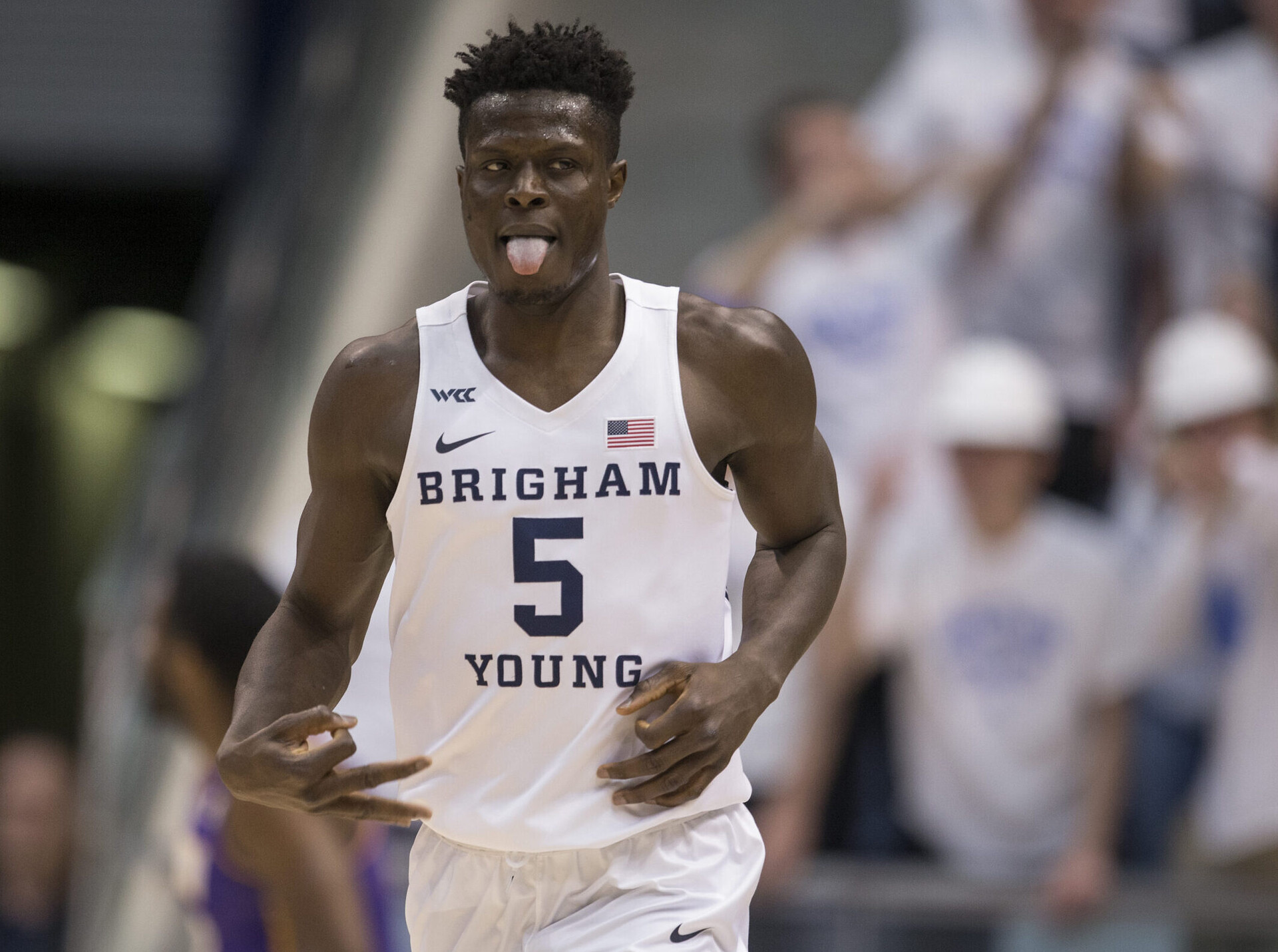 Gideon George #5 of the Brigham Young Cougars reacts after making a three-point basket against the Northern Iowa Panthers during the first half of their second round NIT game March 19, 2022 at the Marriott Center in Provo, Utah.