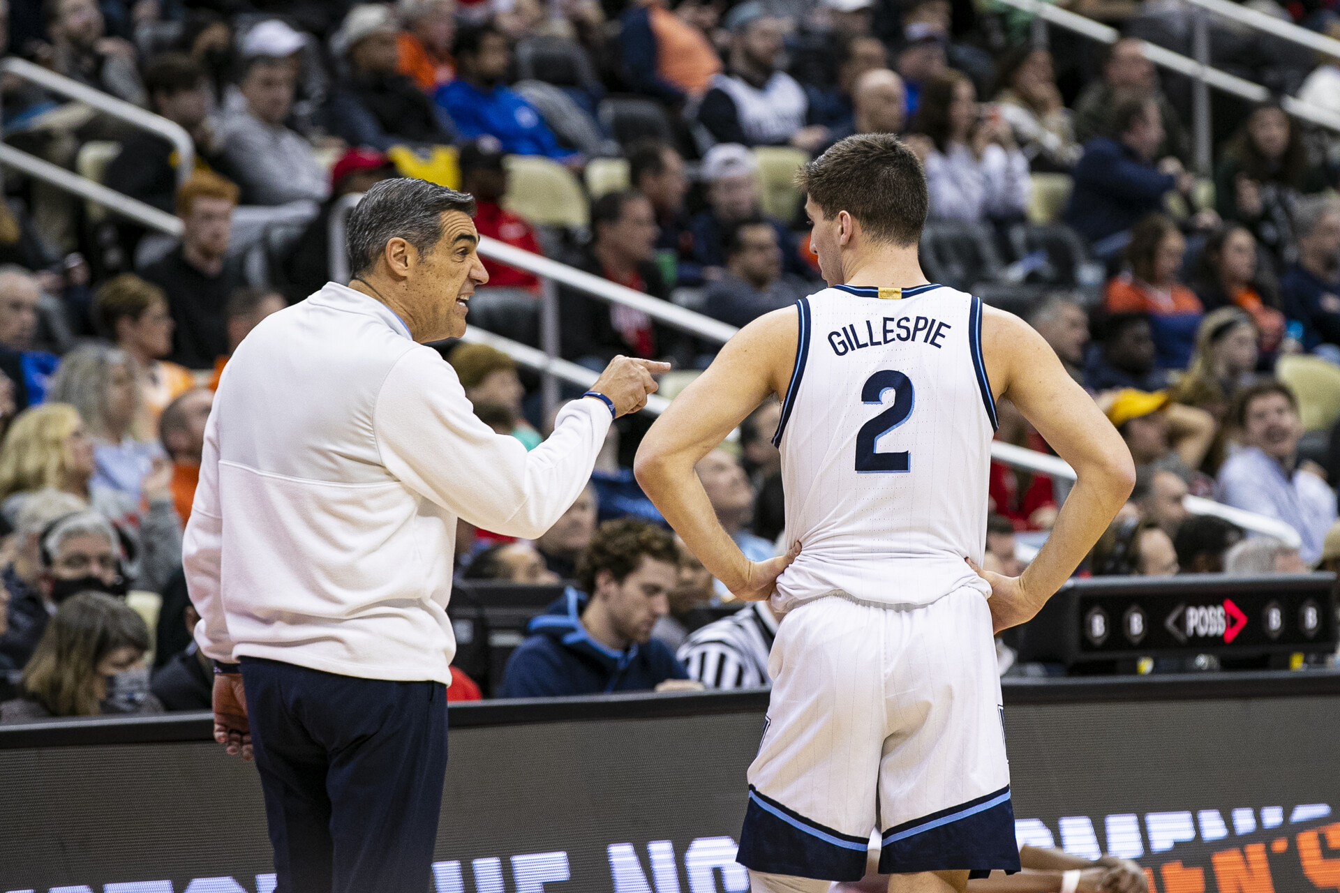 Villanova Wildcats head coach Jay Wright talks to Villanova Wildcats guard Collin Gillespie (2) during the men's March Madness college basketball game