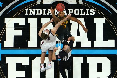 Gonzaga Bulldogs center Drew Timme (left) and Baylor Bears center Flo Thamba (right) jump for the basketball during tip off of the 2021 NCAA national championship game in Indianapolis