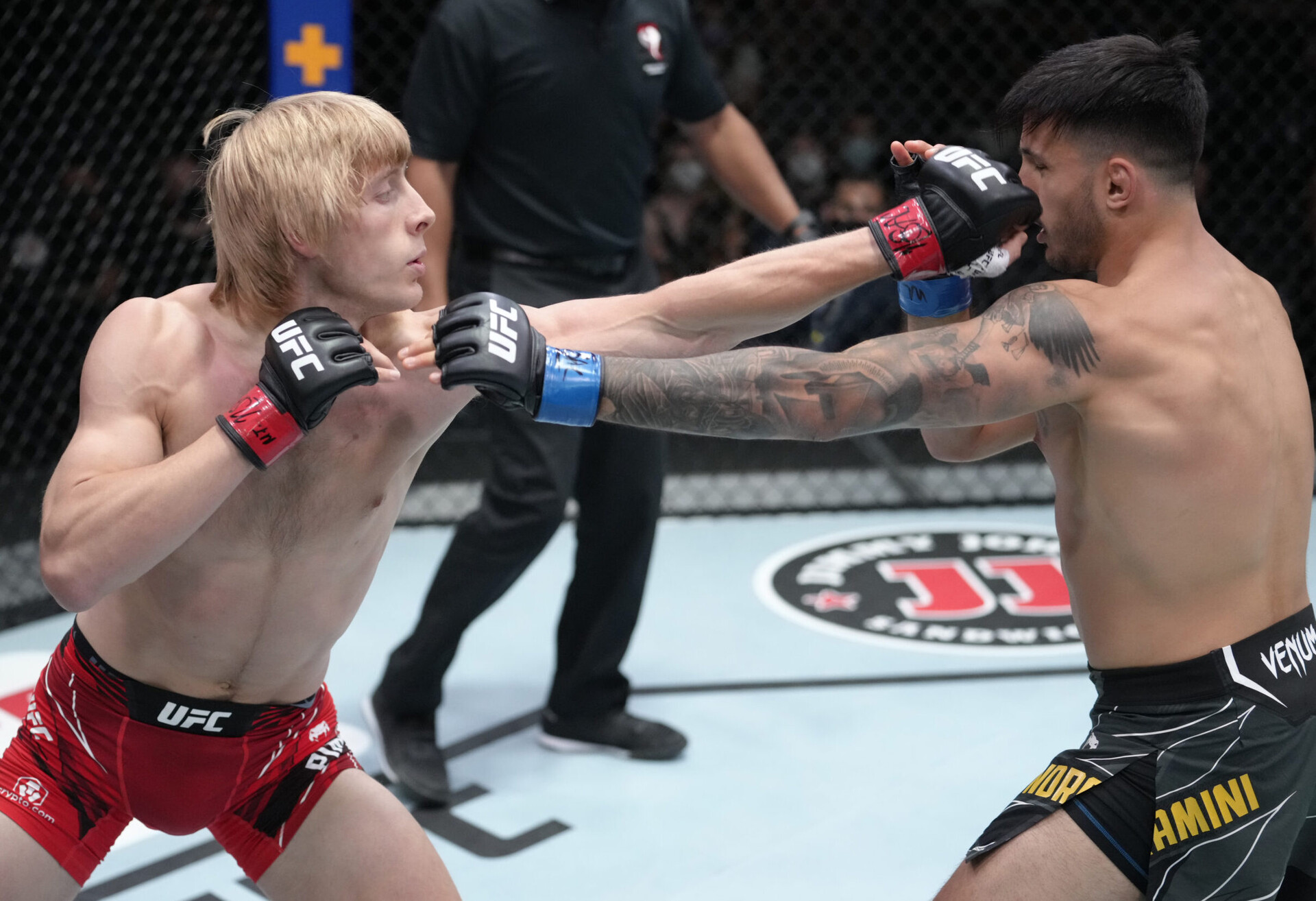 Paddy Pimblett of England (left) lands a straight left hand to the nose of Luigi Vendramini of Brazil (right) during their lightweight UFC Fight Night event