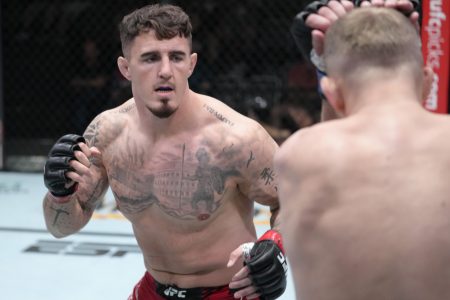 Tom Aspinall of England (right) looks to land a punch with his right hand against Serghei Spivak of the Ukraine in their welterweight fight during UFC Fight Night