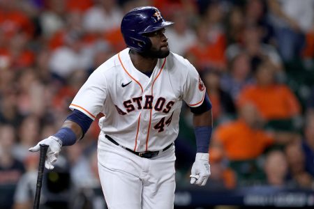 Yordan Alvarez #44 of the Houston Astros hits a triple against the Atlanta Braves during the eighth inning in Game One of the World Series at Minute Maid Park on October 26, 2021 in Houston, Texas.