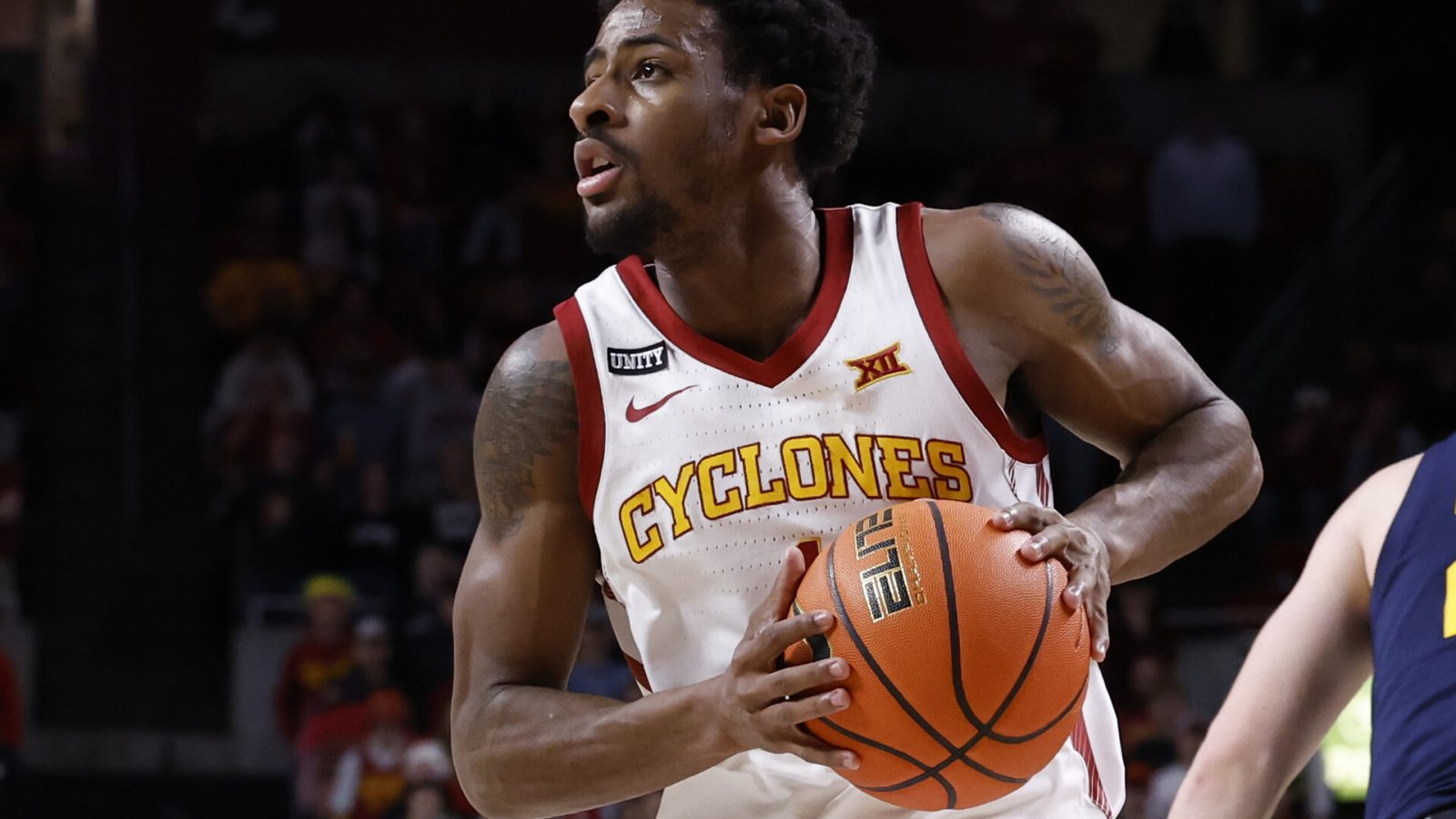 Izaiah Brockington #1 of the Iowa State Cyclones passes the ball in the first half of play at Hilton Coliseum on February 23, 2022 in Ames, Iowa. The Iowa State Cyclones won 84-81 over the West Virginia Mountaineers.