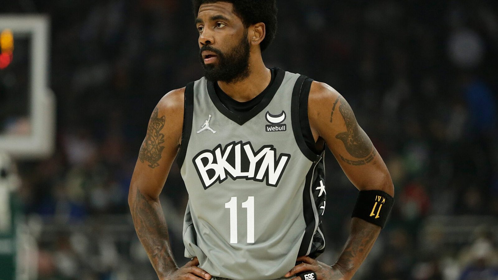 Kyrie Irving #11 of the Brooklyn Nets looks on during the first half of a game against the Milwaukee Bucks at Fiserv Forum on February 26, 2022 in Milwaukee, Wisconsin.
