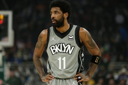 Kyrie Irving #11 of the Brooklyn Nets looks on during the first half of a game against the Milwaukee Bucks at Fiserv Forum on February 26, 2022 in Milwaukee, Wisconsin.