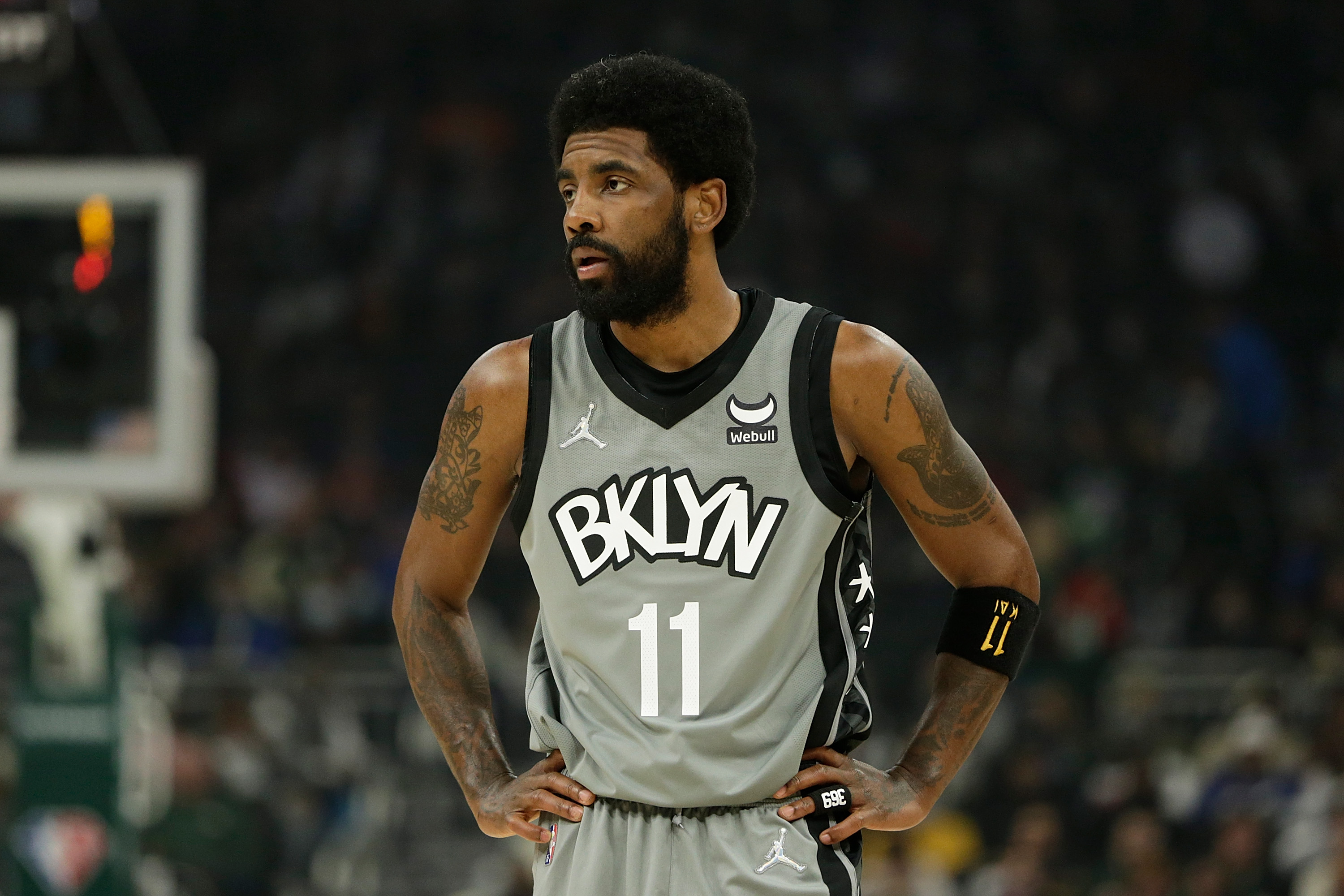 Kyrie Irving #11 of the Brooklyn Nets looks on during the first half of a game against the Milwaukee Bucks at Fiserv Forum on February 26, 2022 in Milwaukee, Wisconsin.