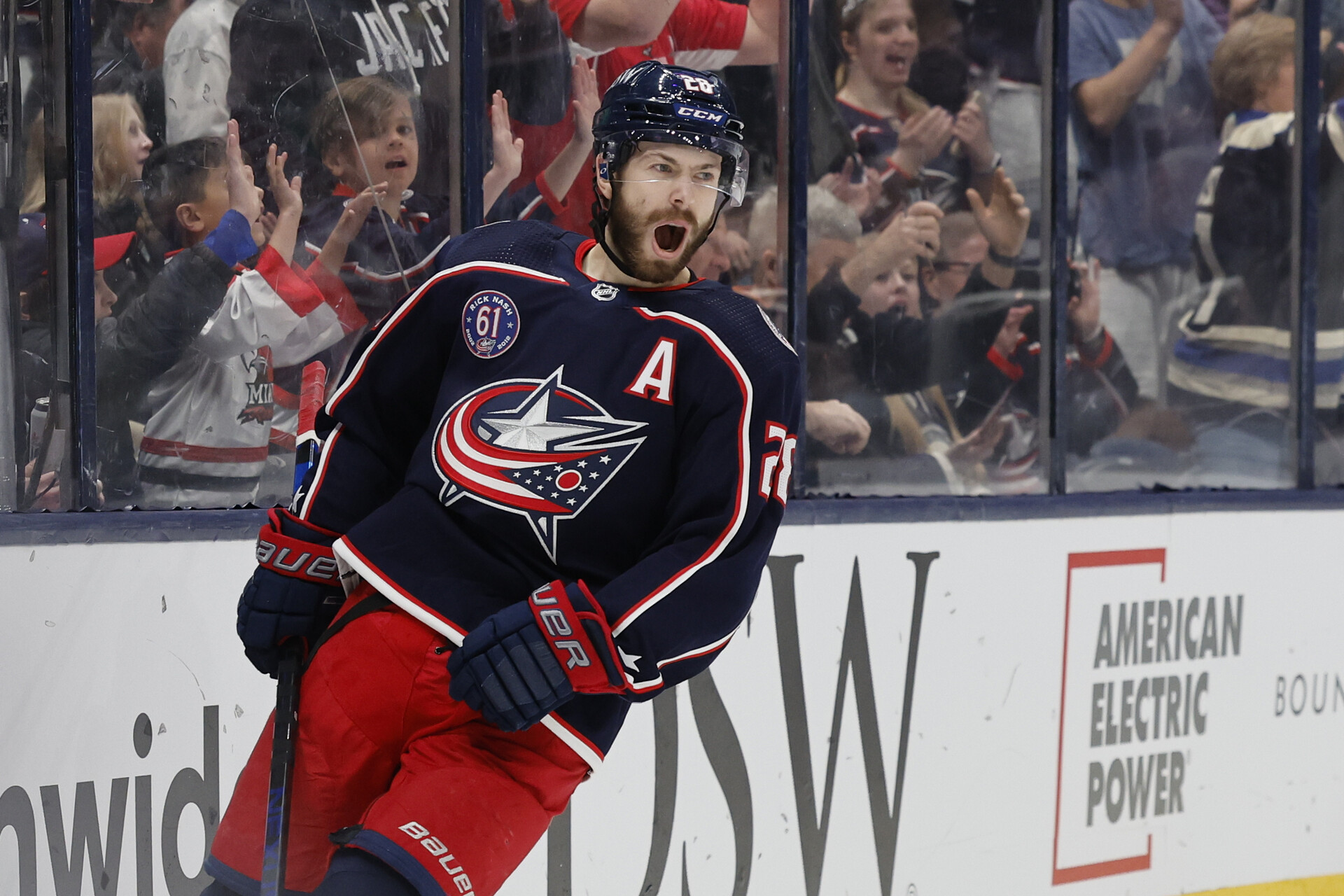 Oliver Bjorkstrand #28 of the Columbus Blue Jackets celebrates a goal by Zach Werenski #8 of the Columbus Blue Jacketsin the second period against the Boston Bruins at Nationwide Arena on March 05, 2022 in Columbus, Ohio.