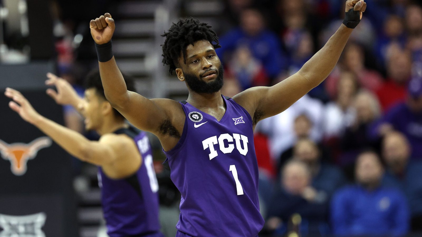 Mike Miles #1 of the TCU Horned Frogs reacts after defeating the Texas Longhorns 65-60 in the first round game of the 2022 Phillips 66 Big 12 Men's Basketball Tournament at T-Mobile Center on March 10, 2022 in Kansas City, Missouri.