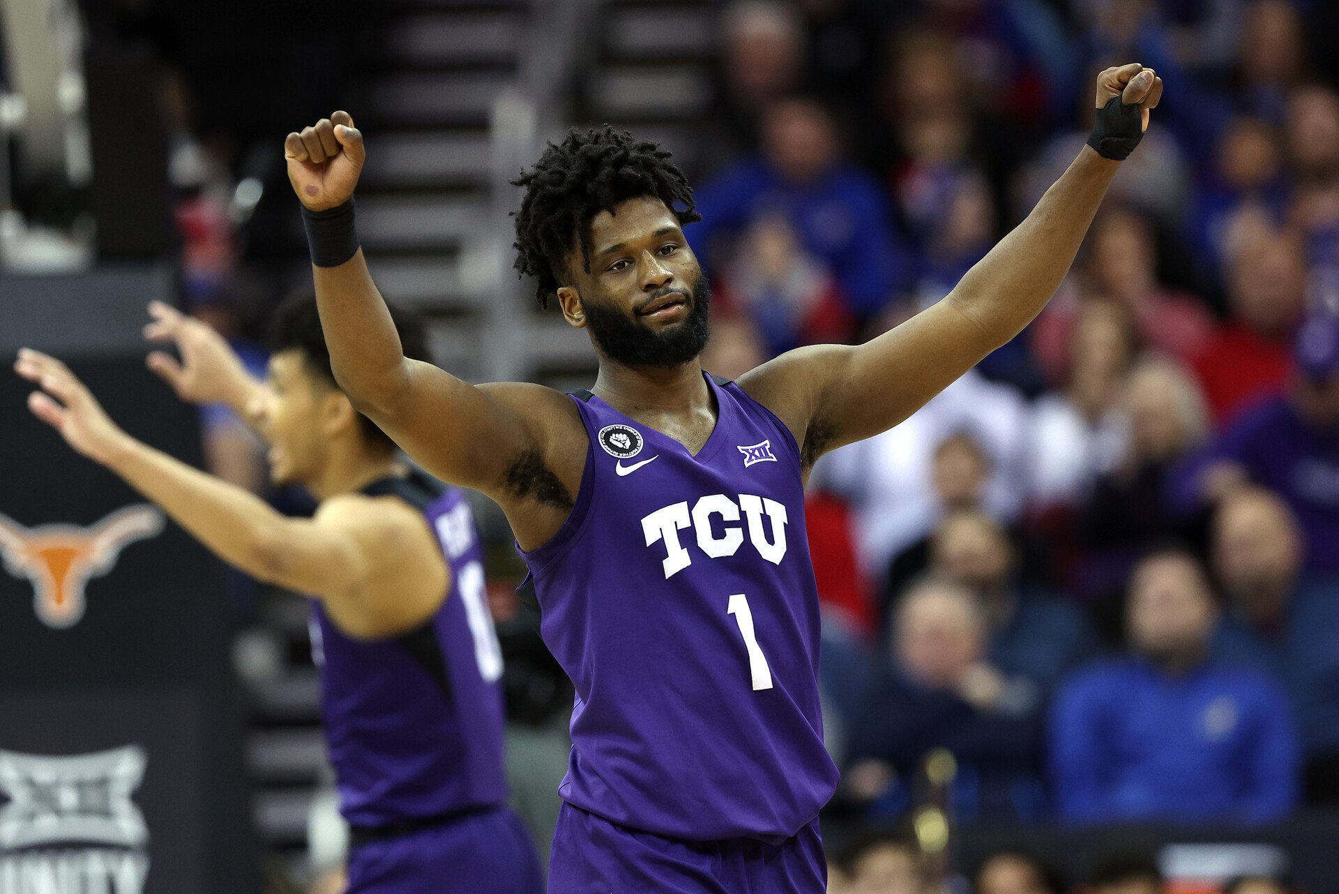 Mike Miles #1 of the TCU Horned Frogs reacts after defeating the Texas Longhorns 65-60 in the first round game of the 2022 Phillips 66 Big 12 Men's Basketball Tournament at T-Mobile Center on March 10, 2022 in Kansas City, Missouri.