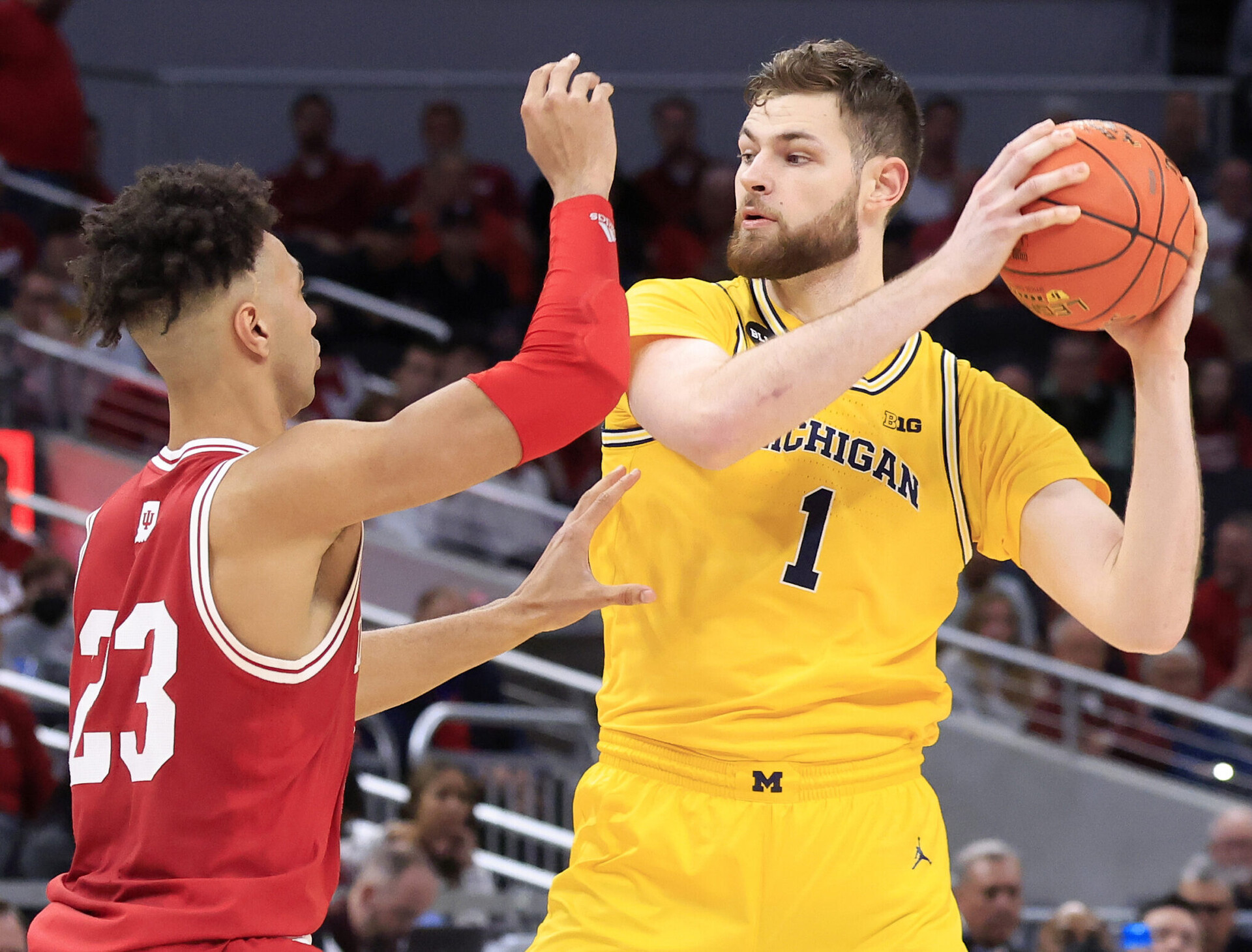 Hunter Dickinson #1 of the Michigan Wolverines looks to make a move on Trayce Jackson-Davis #23 of the Indiana Hoosiers during the Big Ten Tournament at Gainbridge Fieldhouse on March 10, 2022 in Indianapolis, Indiana.