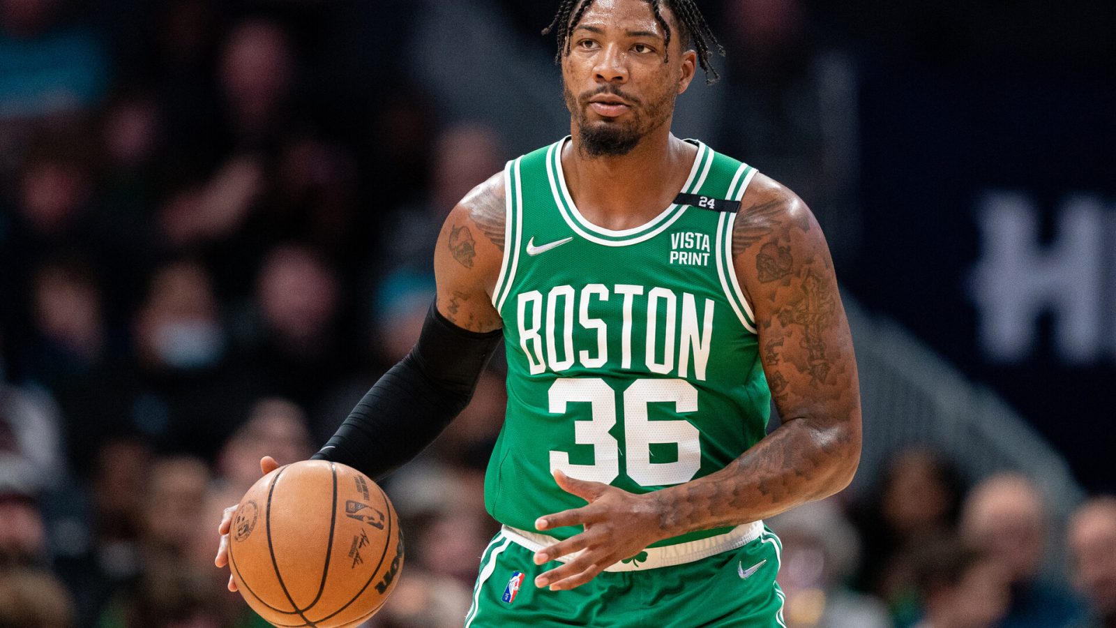 Marcus Smart #36 of the Boston Celtics brings the ball up court against the Charlotte Hornets during their game at Spectrum Center on March 09, 2022 in Charlotte, North Carolina.