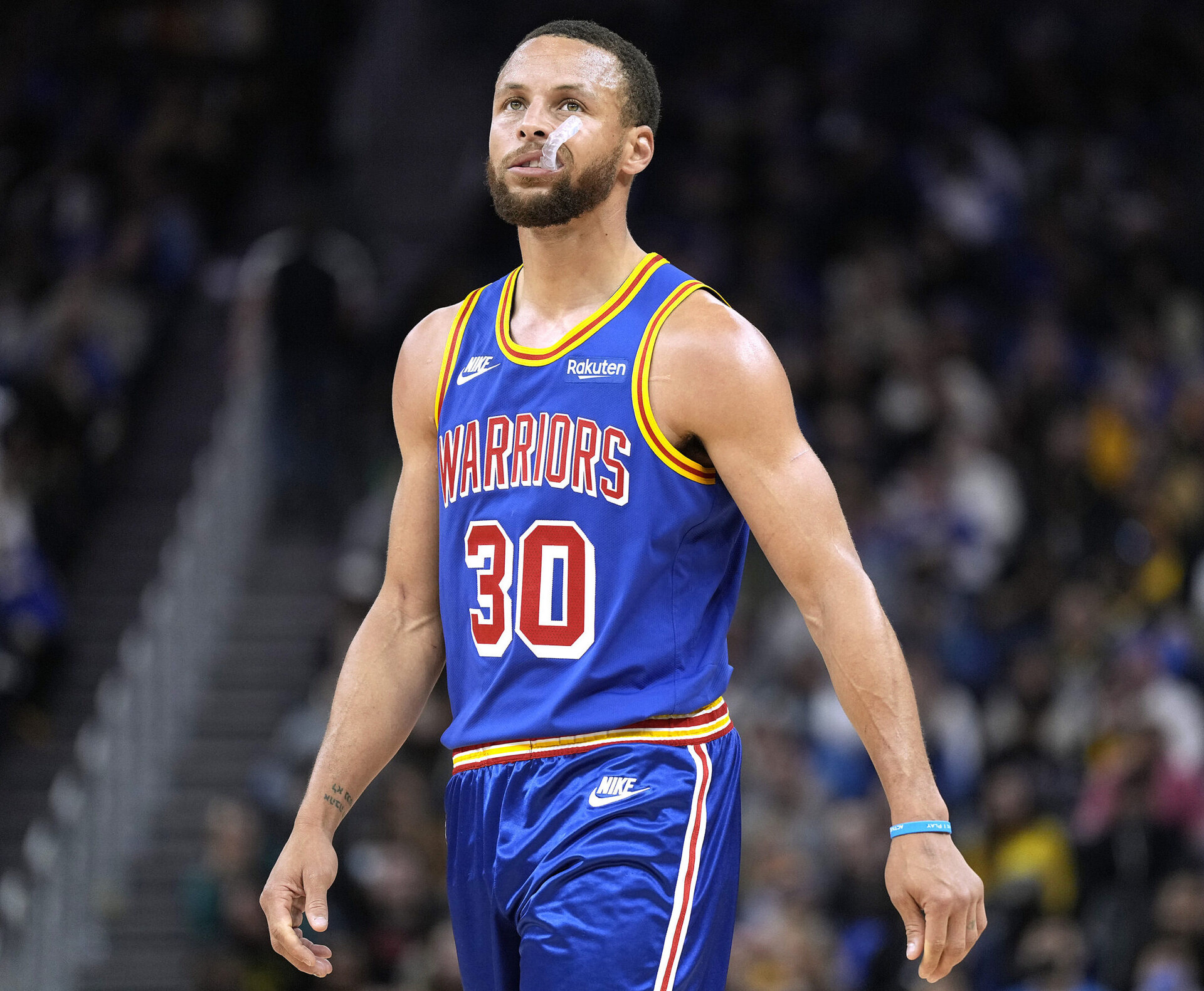 Stephen Curry #30 of the Golden State Warriors looks on against the Milwaukee Bucks in the second half of an NBA basketball game at Chase Center on March 12, 2022 in San Francisco, California.