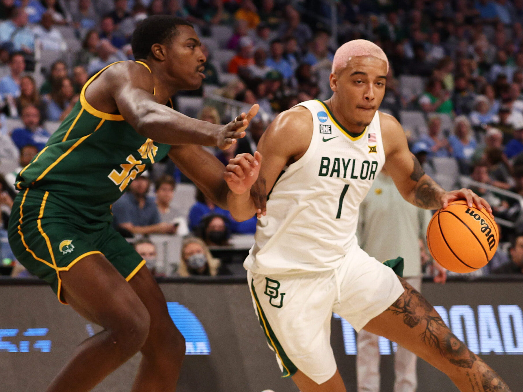 Jeremy Sochan #1 of the Baylor Bears dribbles the ball past Chris Ford #32 of the Norfolk State Spartans in the second half of the game during the first round of the 2022 NCAA Men's Basketball Tournament at Dickies Arena on March 17, 2022 in Fort Worth, Texas