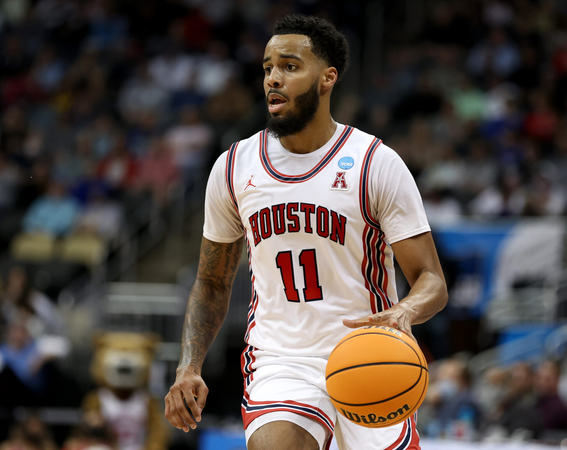 Kyler Edwards #11 of the Houston Cougars dribbles the ball against the UAB Blazers during the first half in the first round game of the 2022 NCAA Men's Basketball Tournament at PPG PAINTS Arena on March 18, 2022