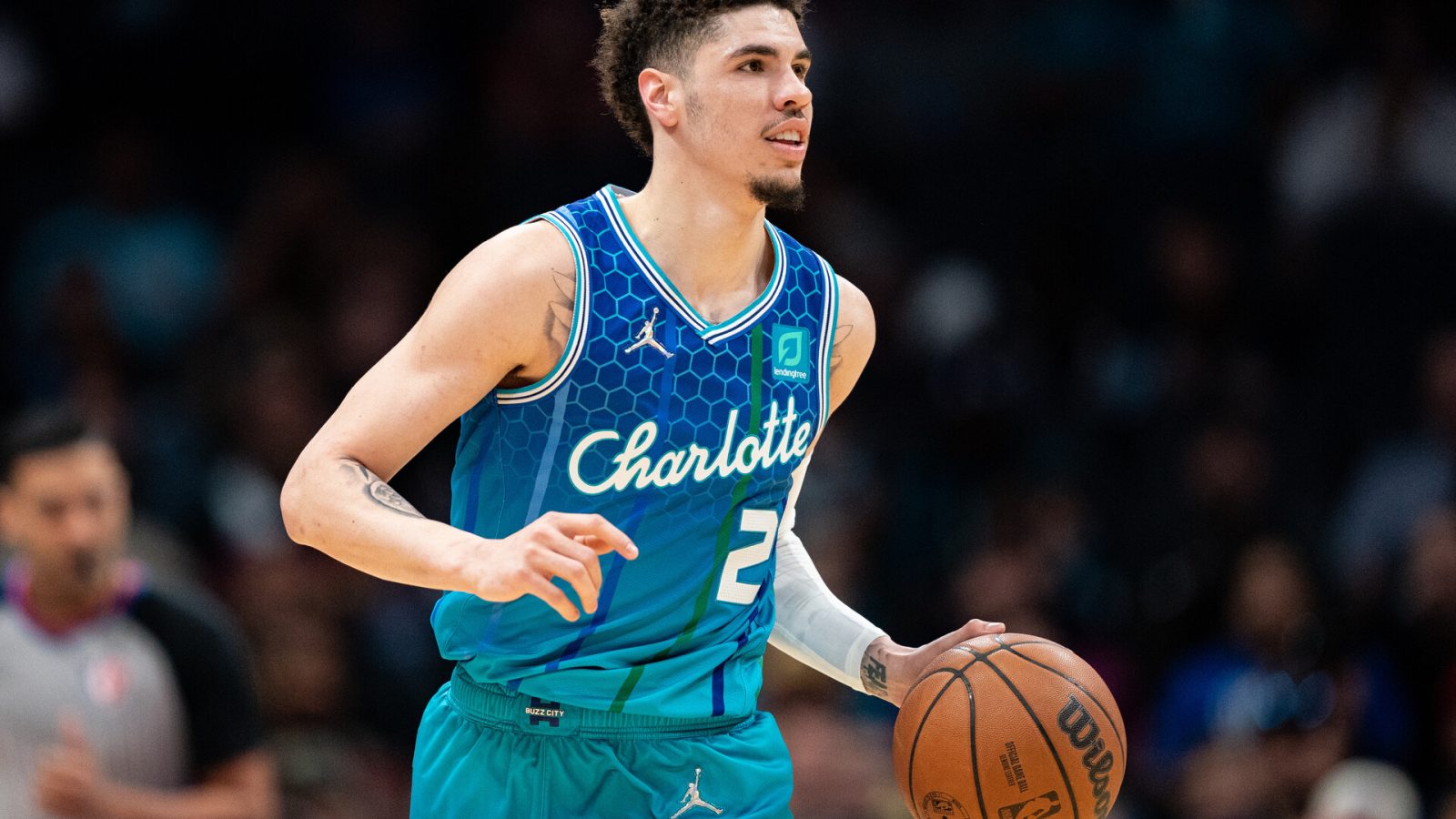 LaMelo Ball #2 of the Charlotte Hornets brings the ball up court against the Dallas Mavericks in the first quarter during their game at Spectrum Center
