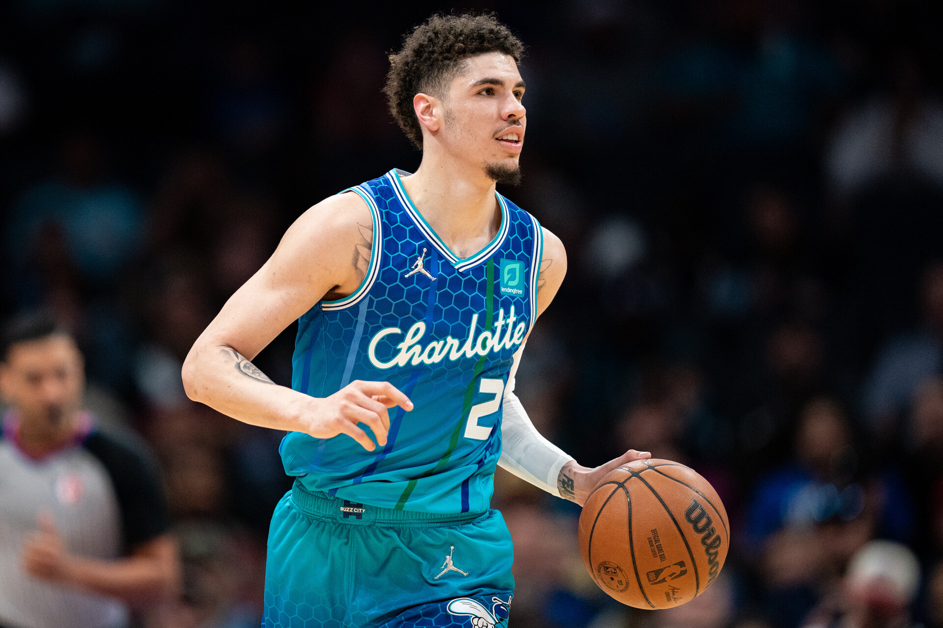 LaMelo Ball #2 of the Charlotte Hornets brings the ball up court against the Dallas Mavericks in the first quarter during their game at Spectrum Center
