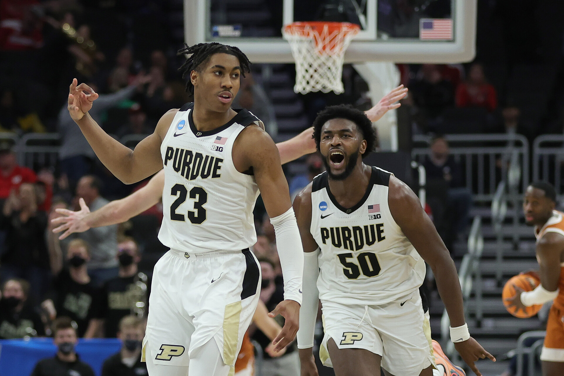 Jaden Ivey #23 and Trevion Williams #50 of the Purdue Boilermakers react after a 3-point basket during the second half against the Texas Longhorns in the second round of the 2022 NCAA Men's Basketball Tournament at Fiserv Forum on March 20, 2022 in Milwaukee, Wisconsin.