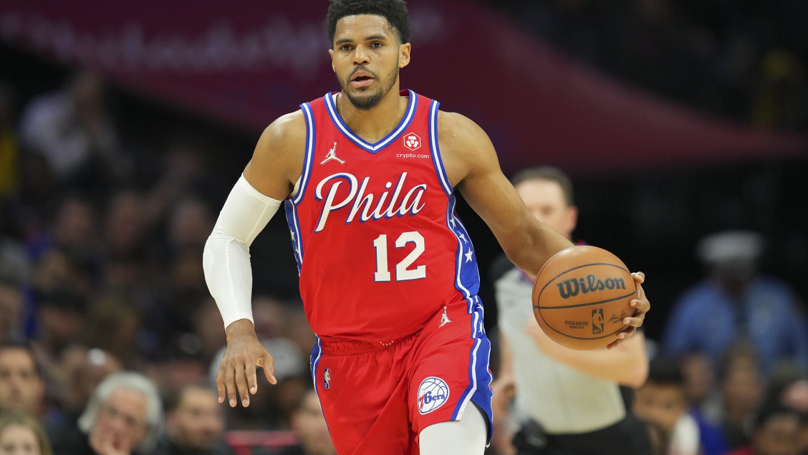 Tobias Harris #12 of the Philadelphia 76ers dribbles the ball against the Miami Heat at the Wells Fargo Center on March 21, 2022 in Philadelphia, Pennsylvania. The 76ers defeated the Heat 113-106.