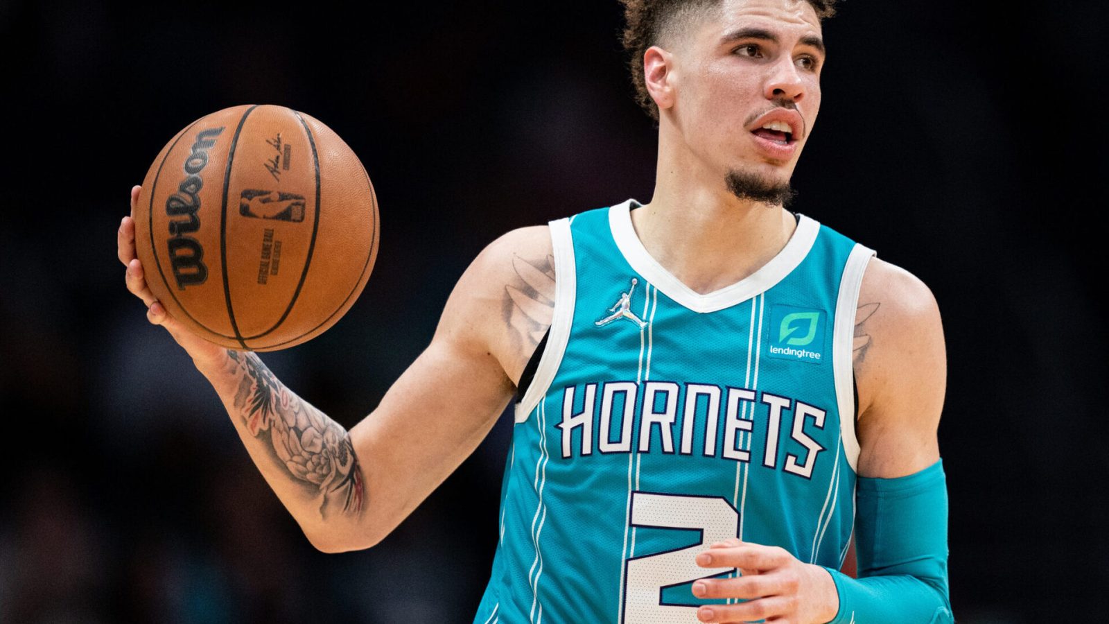 LaMelo Ball #2 of the Charlotte Hornets brings the ball up court against the New York Knicks during their game at Spectrum Center on March 23, 2022 in Charlotte, North Carolina.