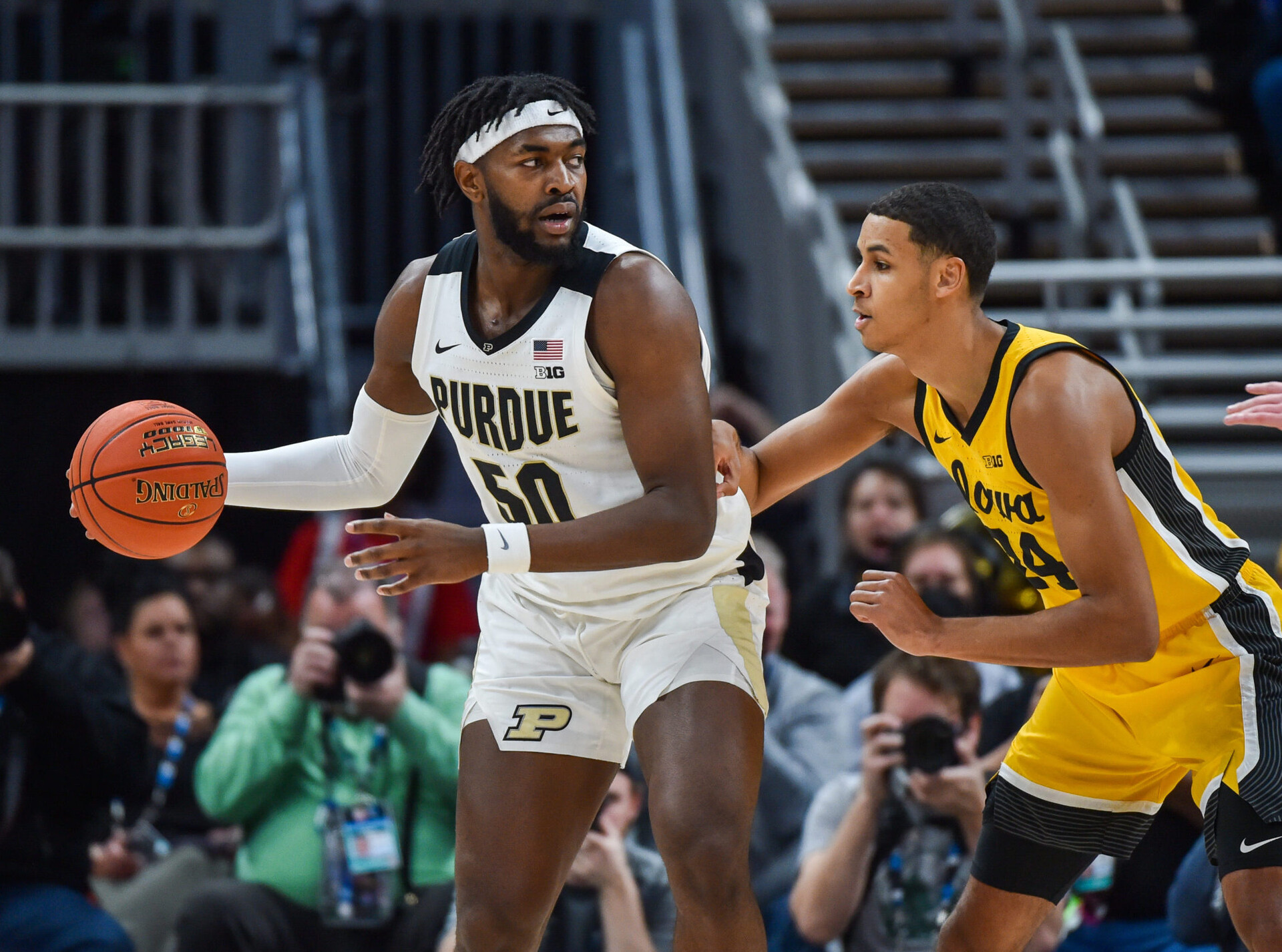 Trevion Williams #50 of the Purdue Boilermakers looks to make a play against Kris Murray #24 of the Iowa Hawkeyes during the first half of the Men's Big Ten Tournament Championship game at Gainbridge Fieldhouse on March 13, 2022 in Indianapolis, Indiana.