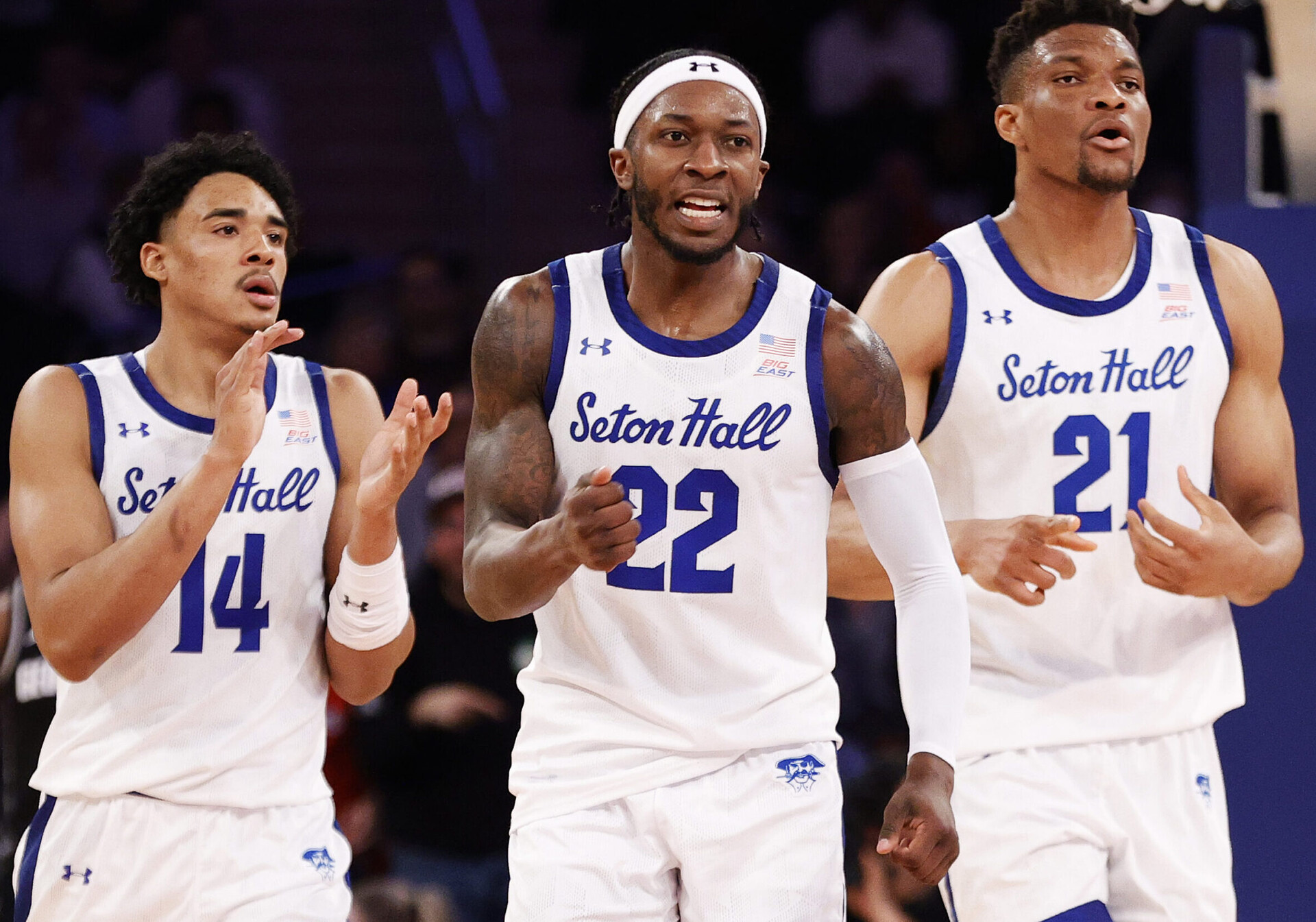 Jared Rhoden #14, Myles Cale #22 and Ike Obiagu #21 of the Seton Hall Pirates react in the first half against the Georgetown Hoyas during the 2022 Big East Tournament at Madison Square Garden on March 09, 2022 in New York City.