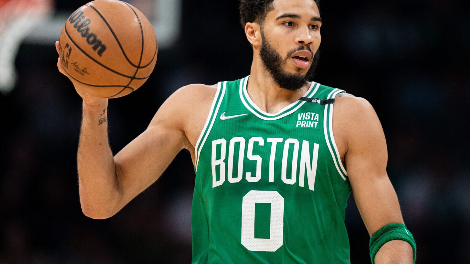 Jayson Tatum of the Boston Celtics brings the ball up court in the first quarter against the Charlotte Hornets at Spectrum Center on March 09, 2022 in Charlotte, North Carolina.