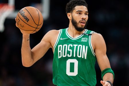 Jayson Tatum of the Boston Celtics brings the ball up court in the first quarter against the Charlotte Hornets at Spectrum Center on March 09, 2022 in Charlotte, North Carolina.