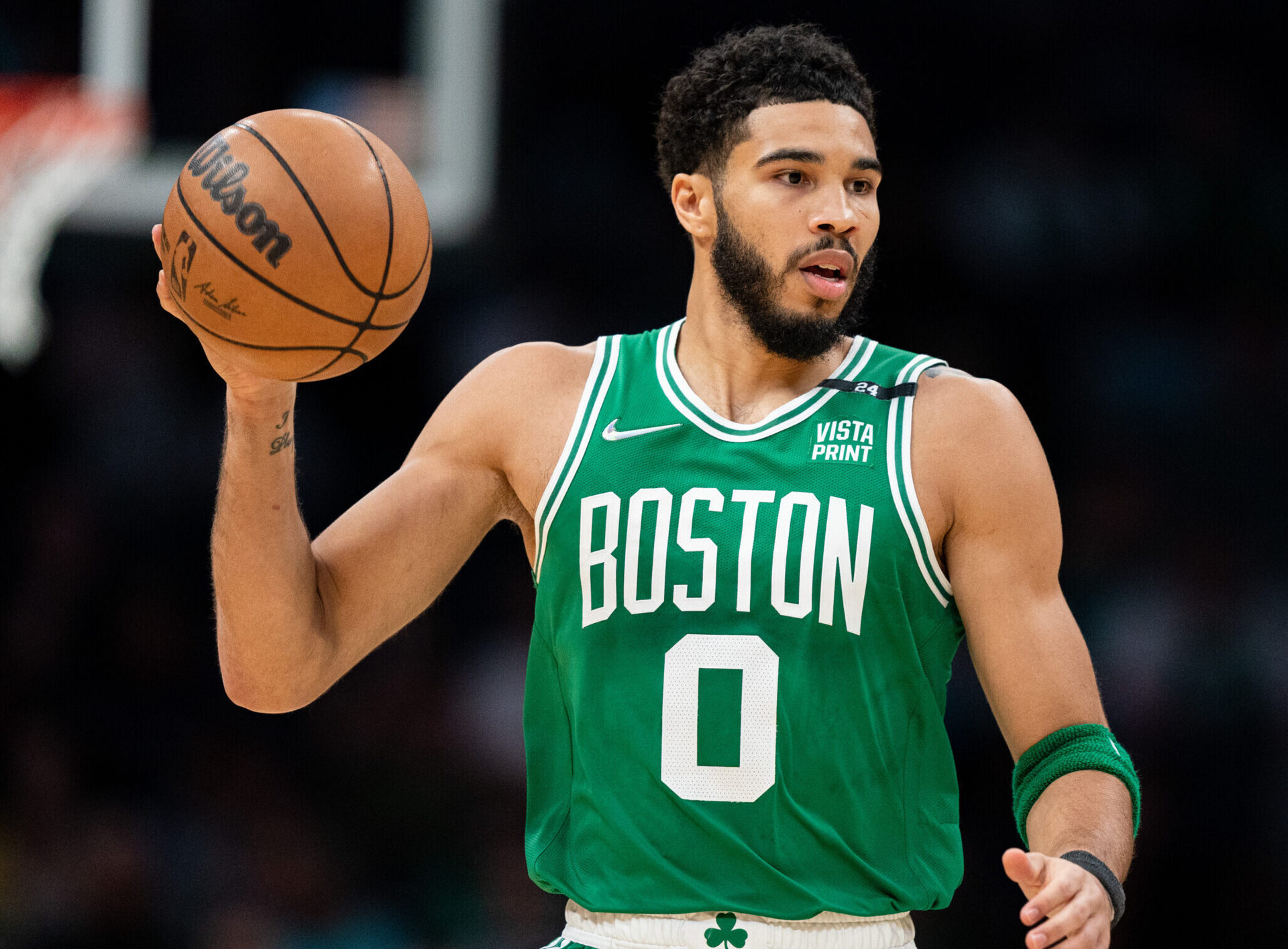Jayson Tatum of the Boston Celtics brings the ball up court in the first quarter against the Charlotte Hornets at Spectrum Center on March 09, 2022 in Charlotte, North Carolina.