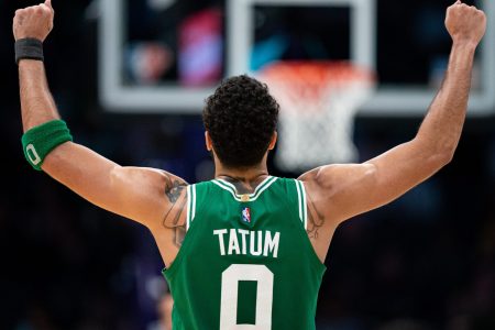 Jayson Tatum #0 of the Boston Celtics celebrates in the fourth quarter during their game against the Charlotte Hornets at Spectrum Center on March 09, 2022 in Charlotte, North Carolina