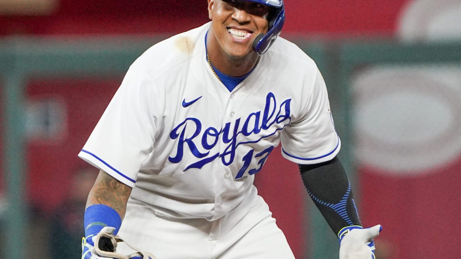 Kansas City Royals catcher Salvador Perez celebrates with his arms outstretched and palms up after hitting a double against the Cleveland Indians