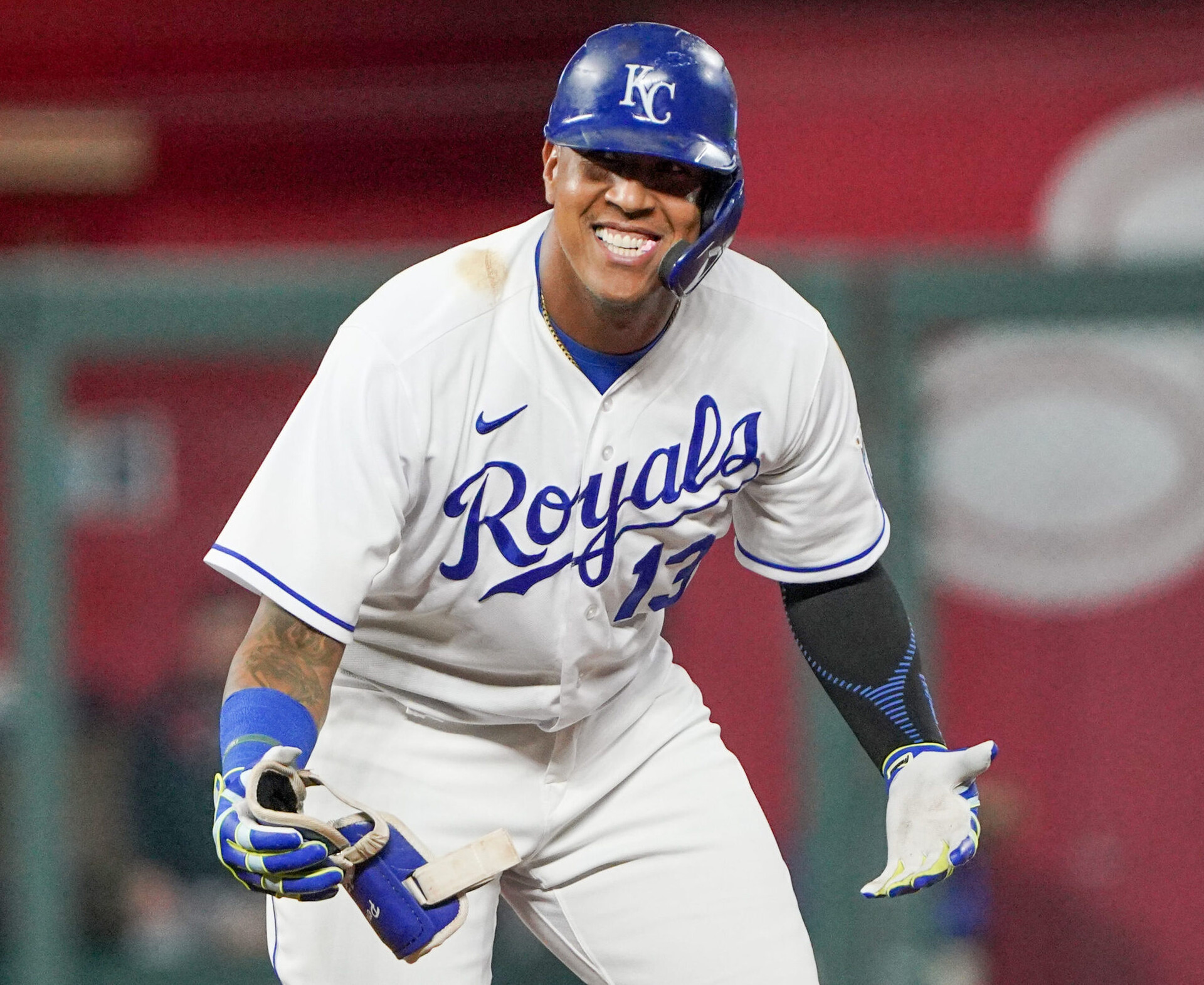 Kansas City Royals catcher Salvador Perez celebrates with his arms outstretched and palms up after hitting a double against the Cleveland Indians