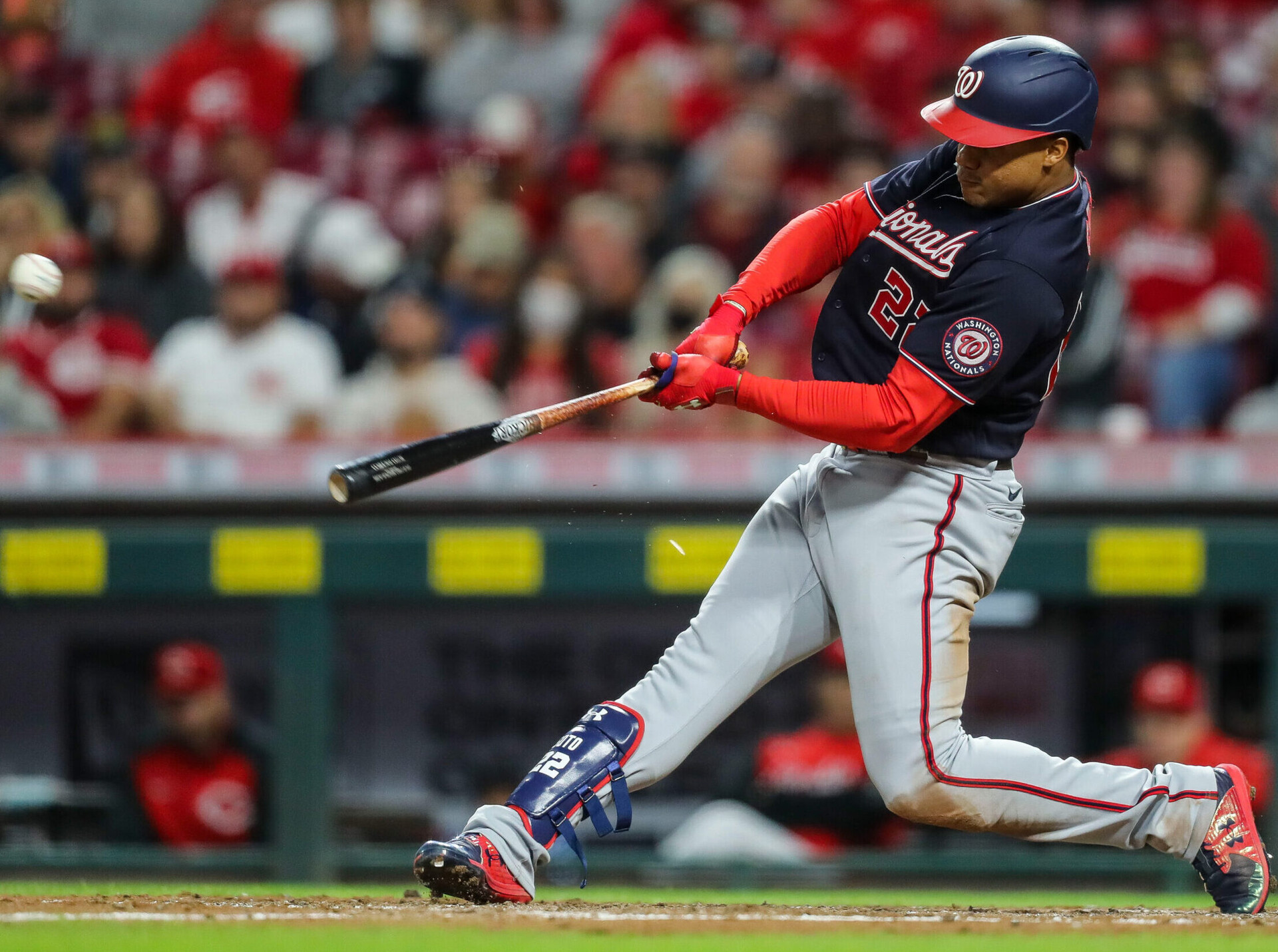 Washington Nationals right fielder Juan Soto follows through on a swing and connects with the baseball for a single against the Cincinnati Reds