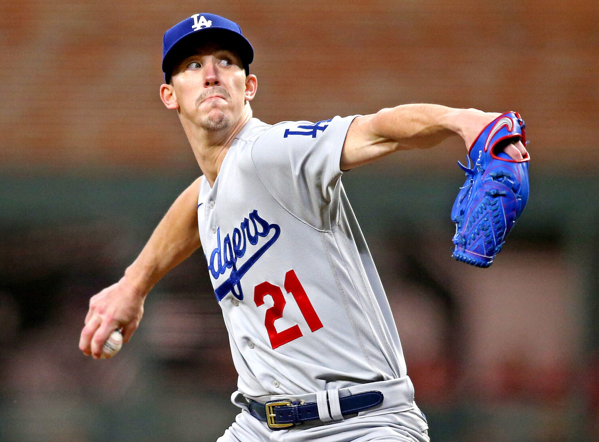 Los Angeles Dodgers right-handed pitcher Walker Buehler reaches back and prepares to throw a pitch during a 2021 National League Championship Series game against the Atlanta Braves