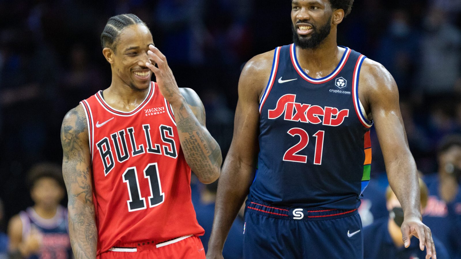 Philadelphia 76ers center Joel Embiid (right) and Chicago Bulls forward DeMar DeRozan (left) share a laugh during a break in the action of a recent game