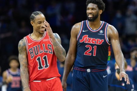 Philadelphia 76ers center Joel Embiid (right) and Chicago Bulls forward DeMar DeRozan (left) share a laugh during a break in the action of a recent game