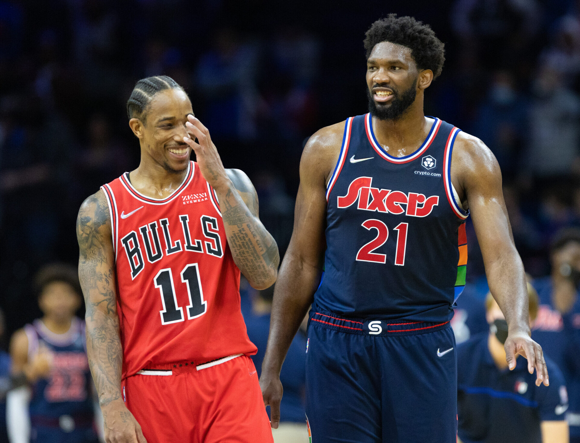Philadelphia 76ers center Joel Embiid (right) and Chicago Bulls forward DeMar DeRozan (left) share a laugh during a break in the action of a recent game