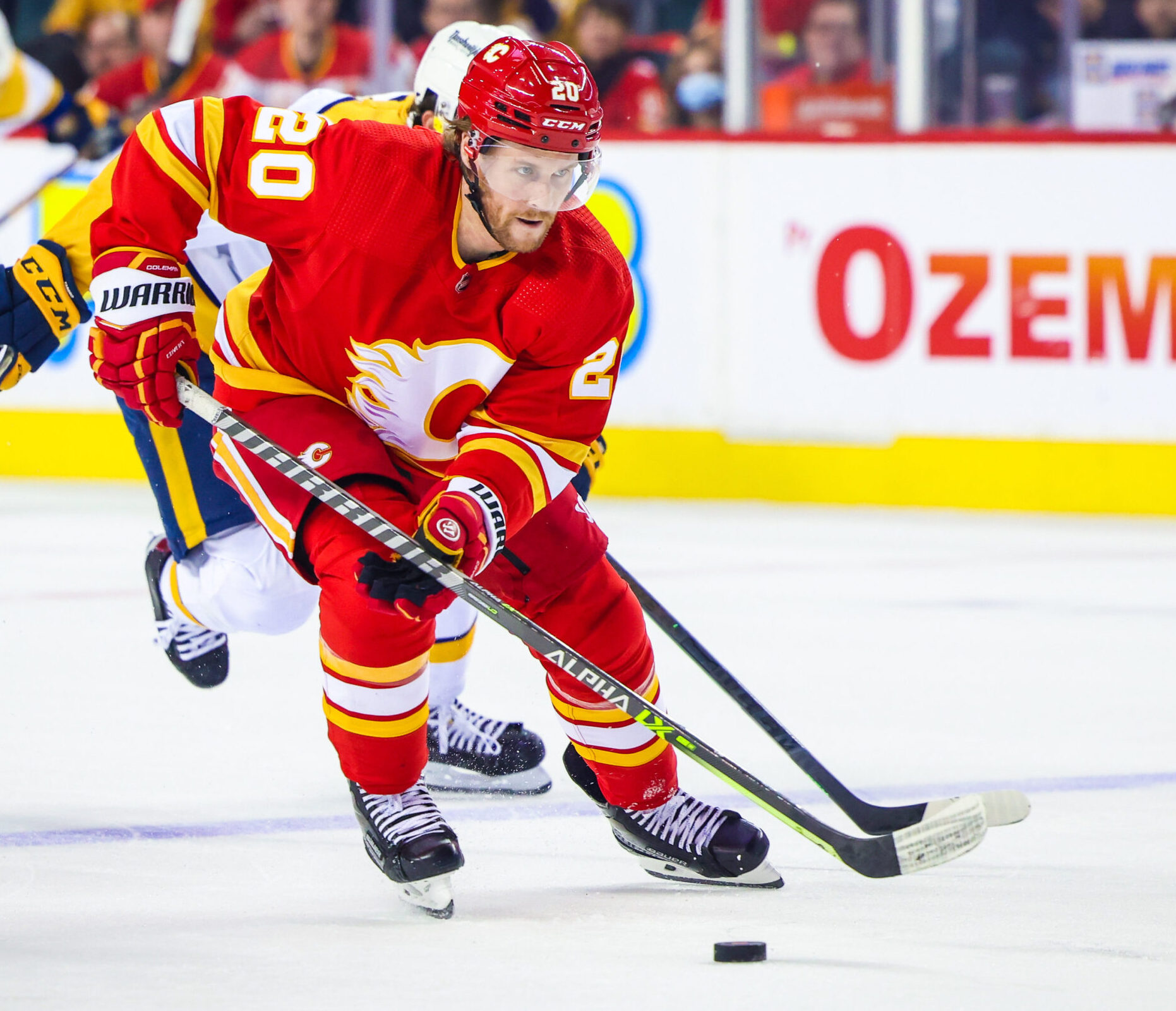 Calgary Flames center Blake Coleman skates with the puck against the Nashville Predators